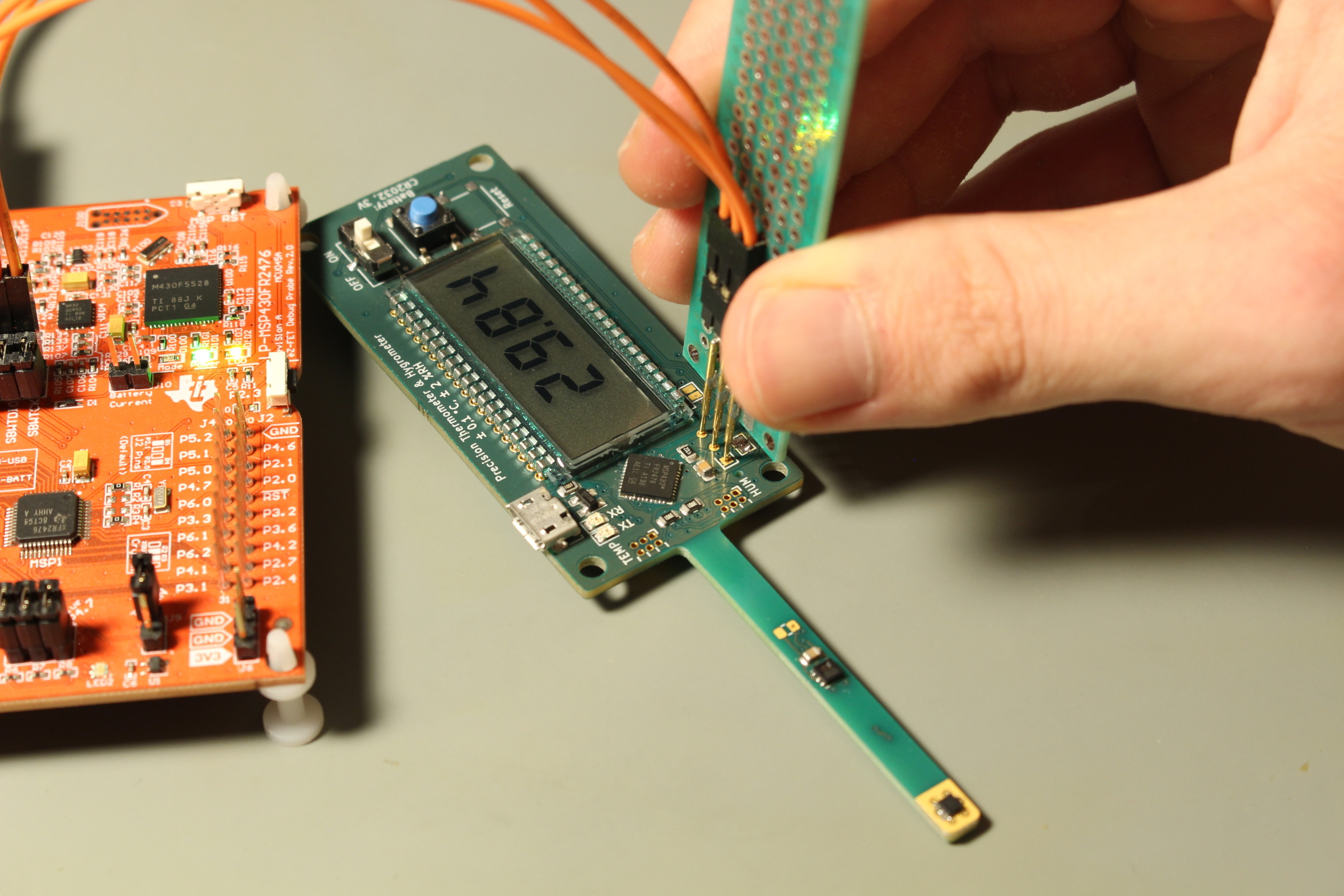 Programming and debugging using the custom pogo pin assembly